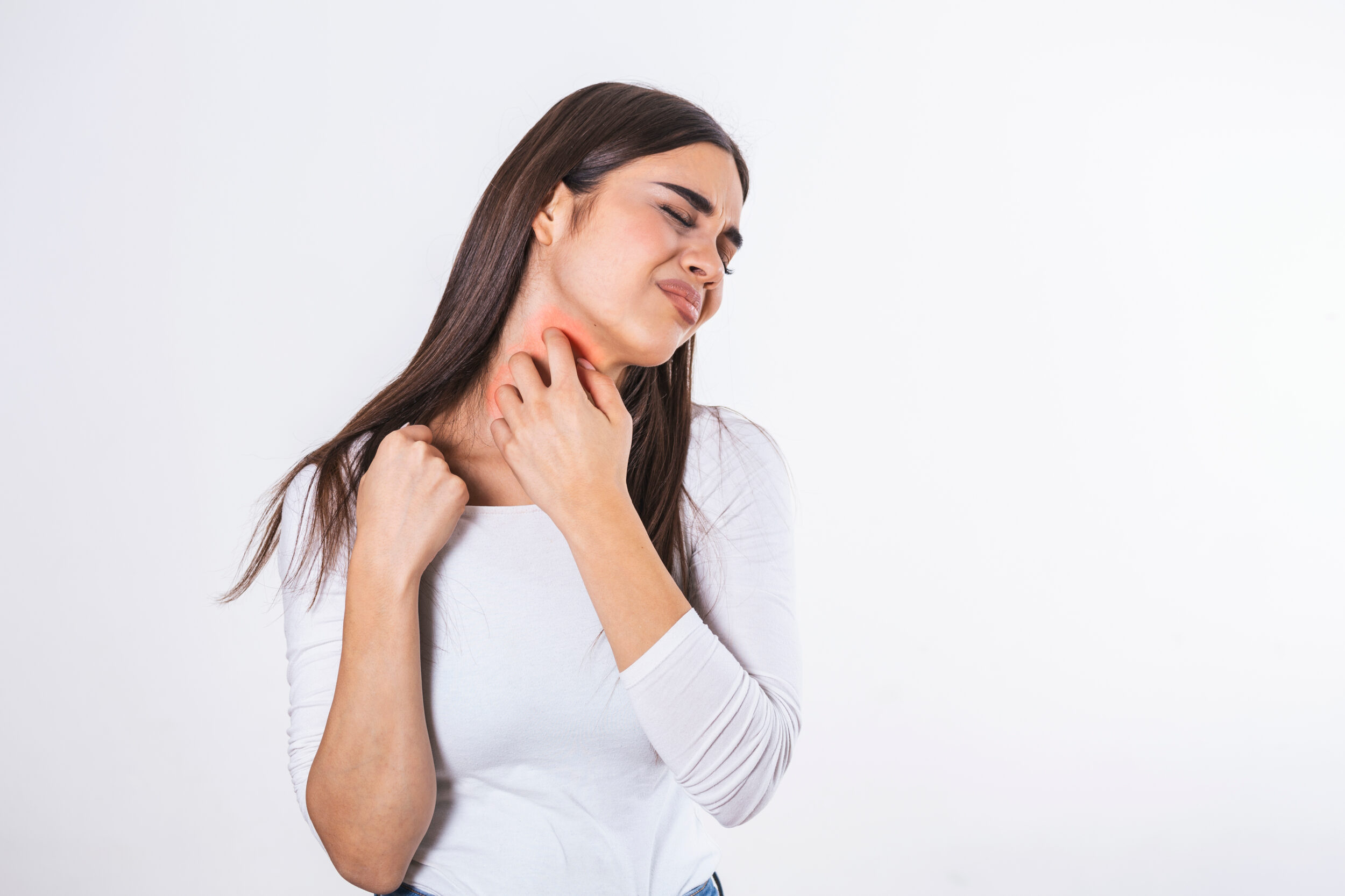 Woman uncomfortable scratching a rash in Jacksonville, FL
